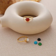 14k Gold filled round natural stone rings with colored stones on a beige surface.
Natural gemstone:
Moonstone,
Carnelian,
Onyx,
Turquoise,
Emerald.